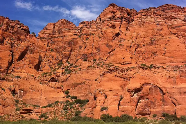 Tall orange-red sandstone rocks under a deep blue sky in Snow Canyon State Park.